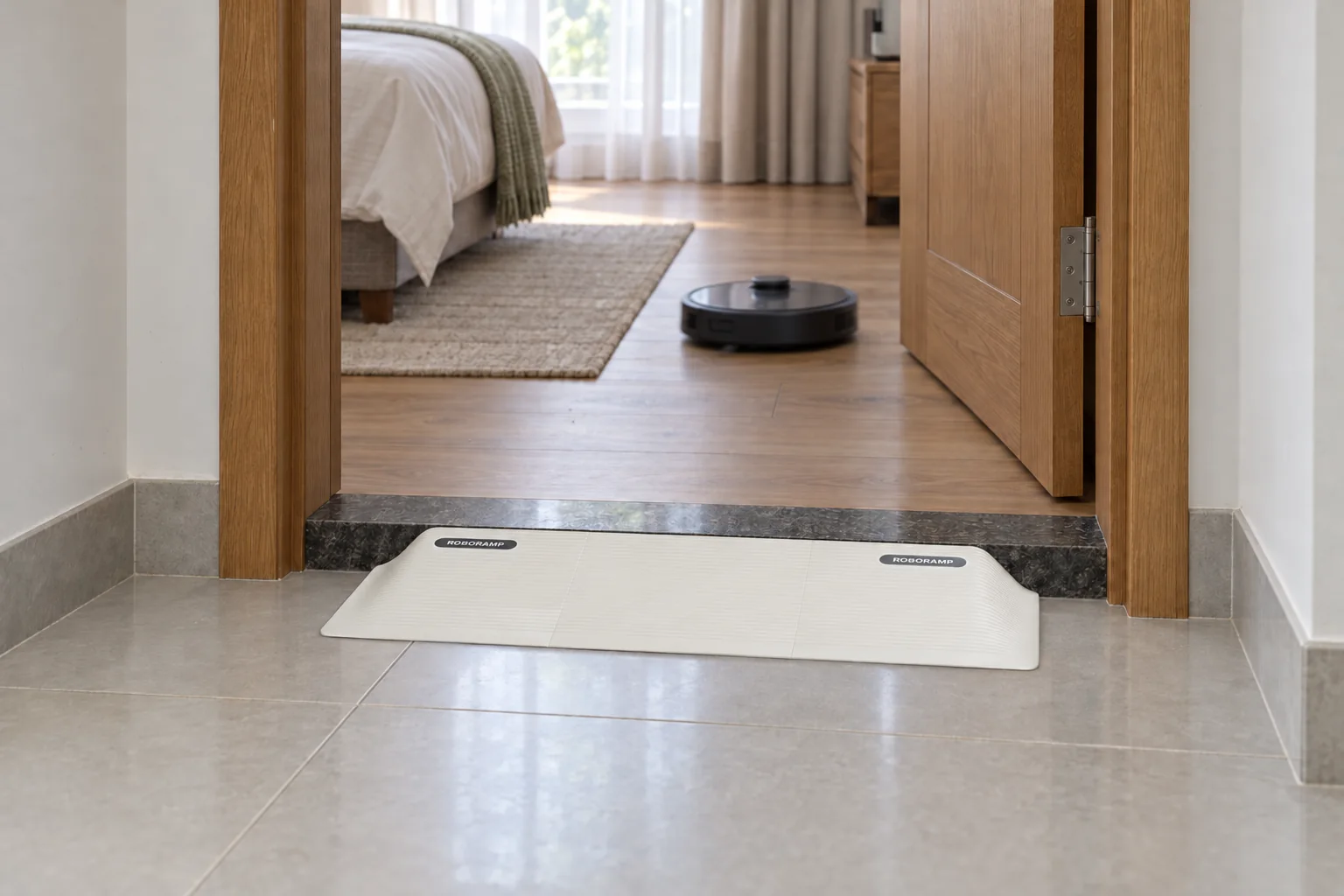RoboRamp at a bedroom doorway between tile and wooden flooring