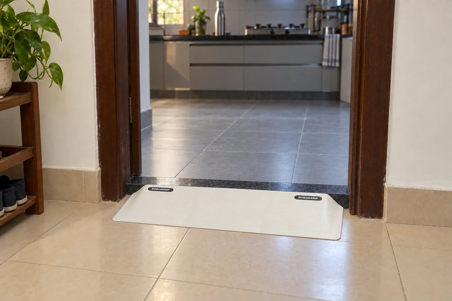 RoboRamp at a kitchen doorway with a black granite threshold