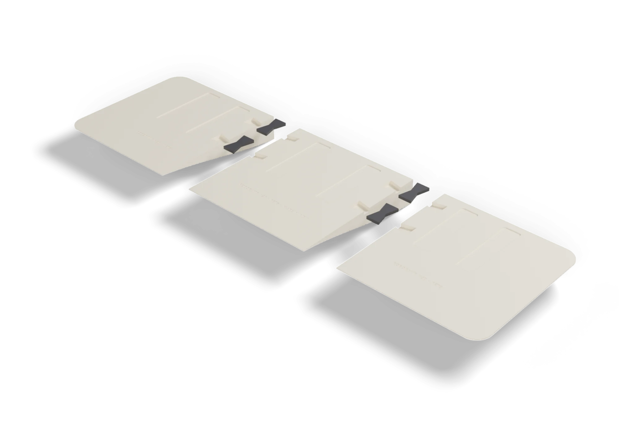 The three ramp pieces face down, slightly apart, with the four keys in their slots
